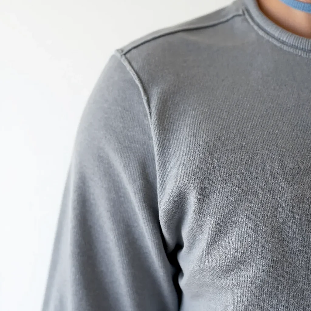Close-up of canvas sneaker fabric texture revealing the weave, with soft studio lighting showing off the material quality